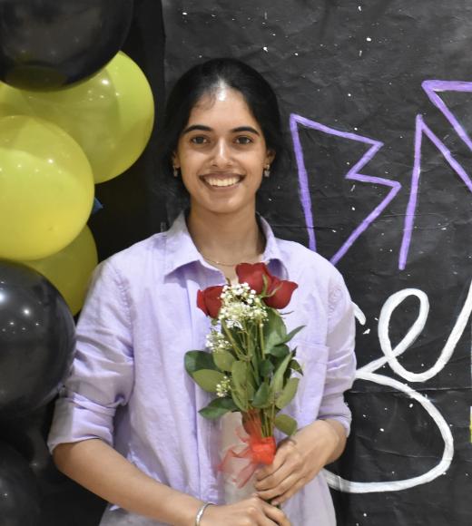 Profile photo of Jasmeet wearing a lavender shirt and holding roses